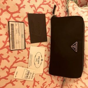 PRADA black zipped nylon wallet.